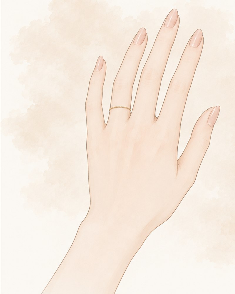 薬指に細いゴールドのリングをつけた左手のイラスト