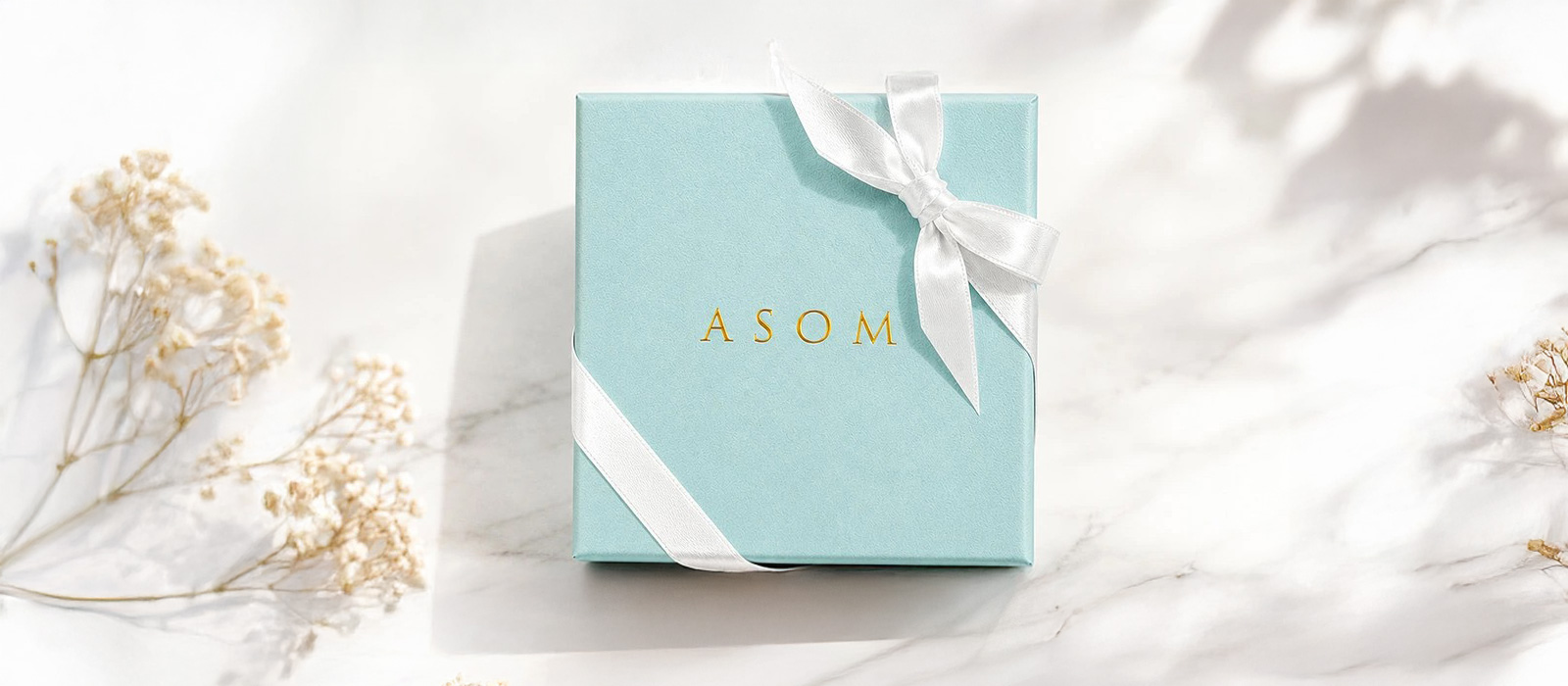 リボンを掛けた ASOM のオリジナルBOX